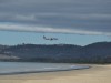 A plane over Seven Mile Beach approaching Hobart Aiport